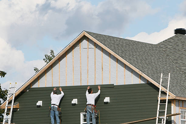 Professional Storm Damage Siding Repair technician working in Huntingdon, TN